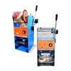 Two blue and orange Semi Auto Cup Sealing Machines FET-B7, featuring black handles for sealing drink containers with plastic film, are displayed: one in a side view and the other from the front.