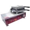 The Belgium Waffle Machine Electric FNP536 features metal plates, two handles, control knobs, and a temperature display.
