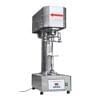 The Bottle Sealing Machine Automatic Can Sealer Stainless Steel Premium No Spin features a rectangular upper chamber, a cylindrical middle section, and a control panel on the front. A red arrow indicates the upper part of the machine.