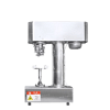 The Bottle Sealing Machine Automatic Can Sealer Stainless Steel Premium No Spin features a cylindrical base, control box, and safety warning label. It is specifically designed for sealing beverage and food cans.