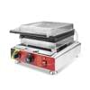 Electric stainless steel commercial waffle and croffle square maker with a deeper size, featuring a flat grilling surface, red and yellow control panel, and black knobs.