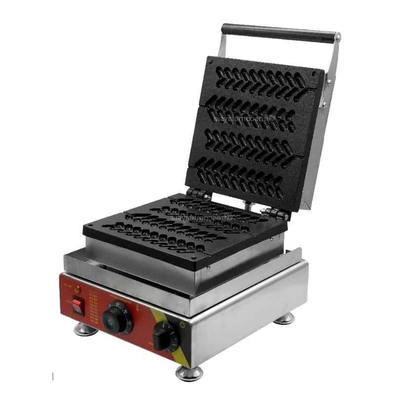 The FRESCO LOLLY TREE WAFFLE STICK MAKER MACHINE WHEAT WAFFLE features an open top lid revealing black, leaf-shaped molds. Its base includes a red panel equipped with a control knob and switch.